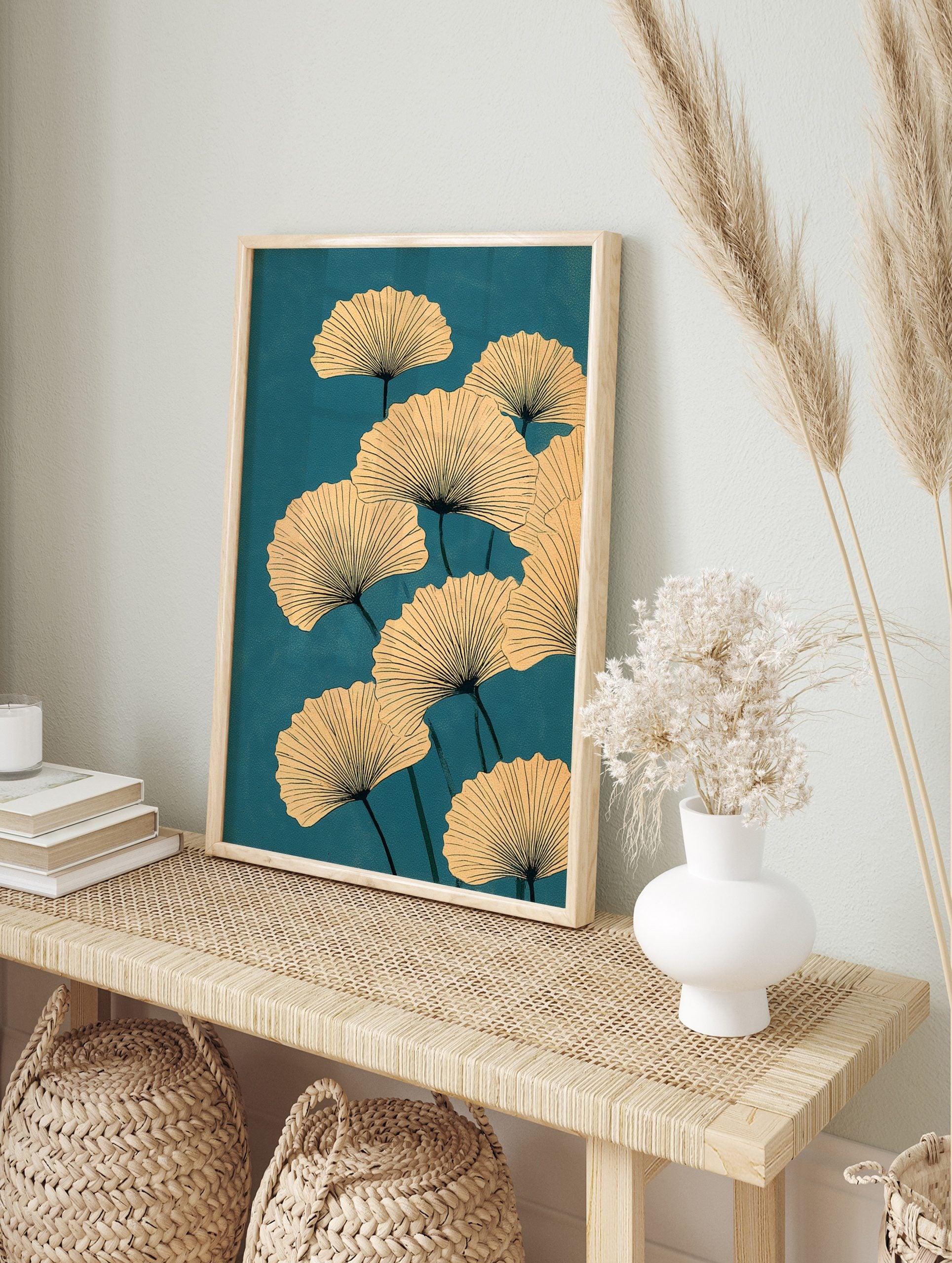 Ginkgo leaf botanical illustration with beige fan-shaped leaves and dark veins on a teal, in an alternate framed mockup