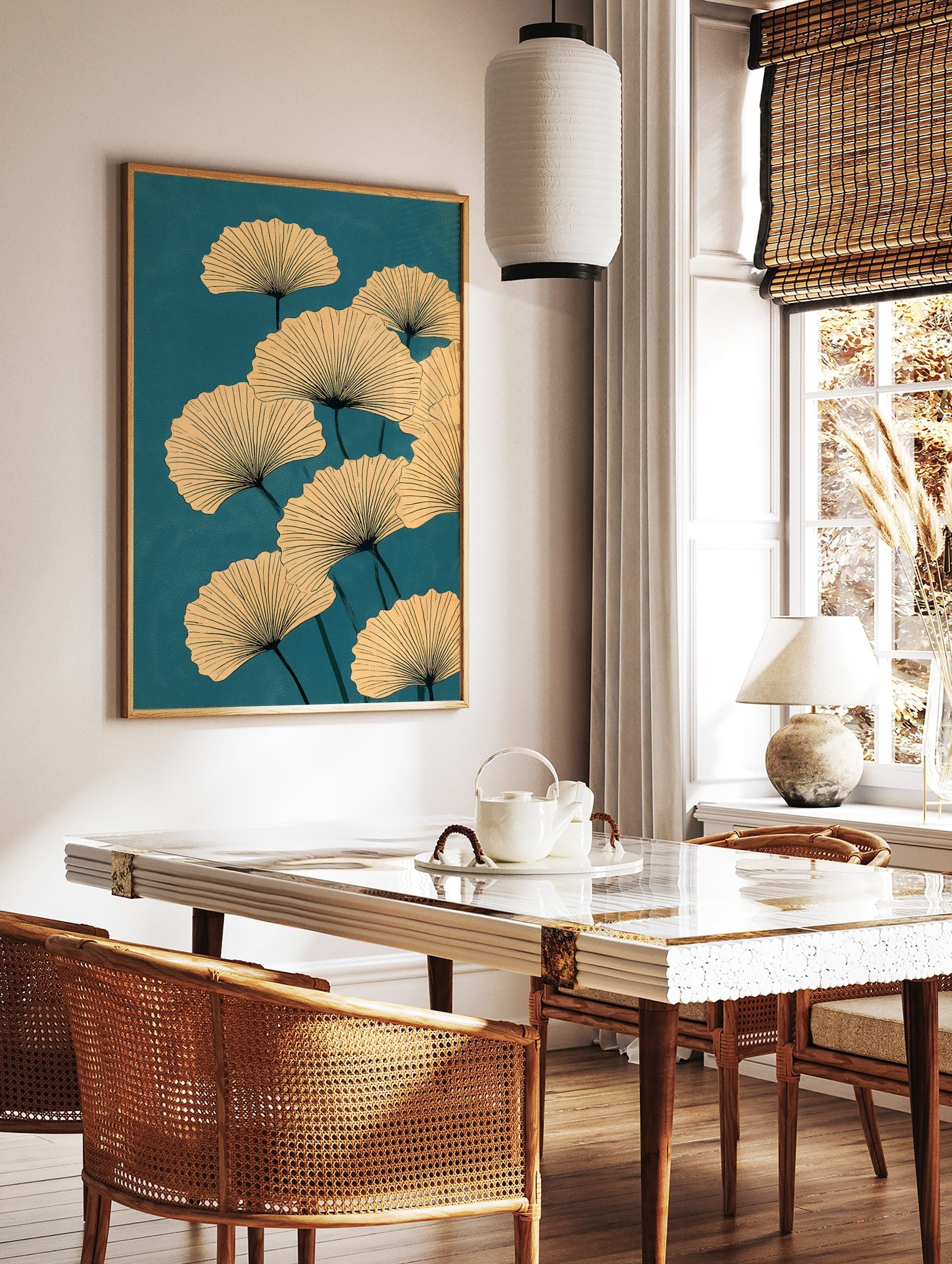 Ginkgo leaf botanical illustration with beige fan-shaped leaves and dark veins on a teal background, in a styled room mockup