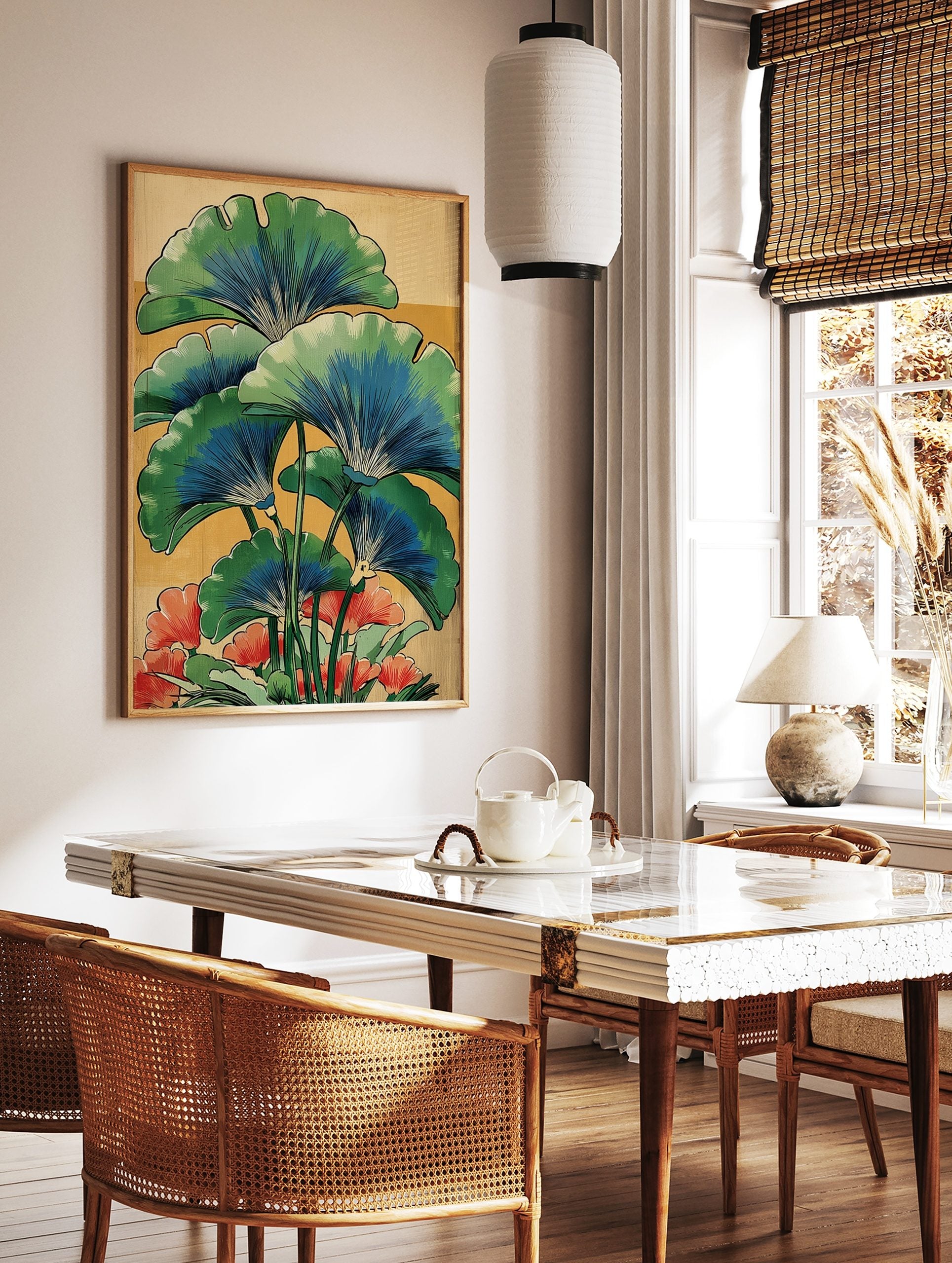 Illustrative botanical print of green and blue ginkgo leaves with red-orange flowers on a warm, in a styled room mockup