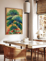 Illustrative botanical print of green and blue ginkgo leaves with red-orange flowers on a warm, in a styled room mockup