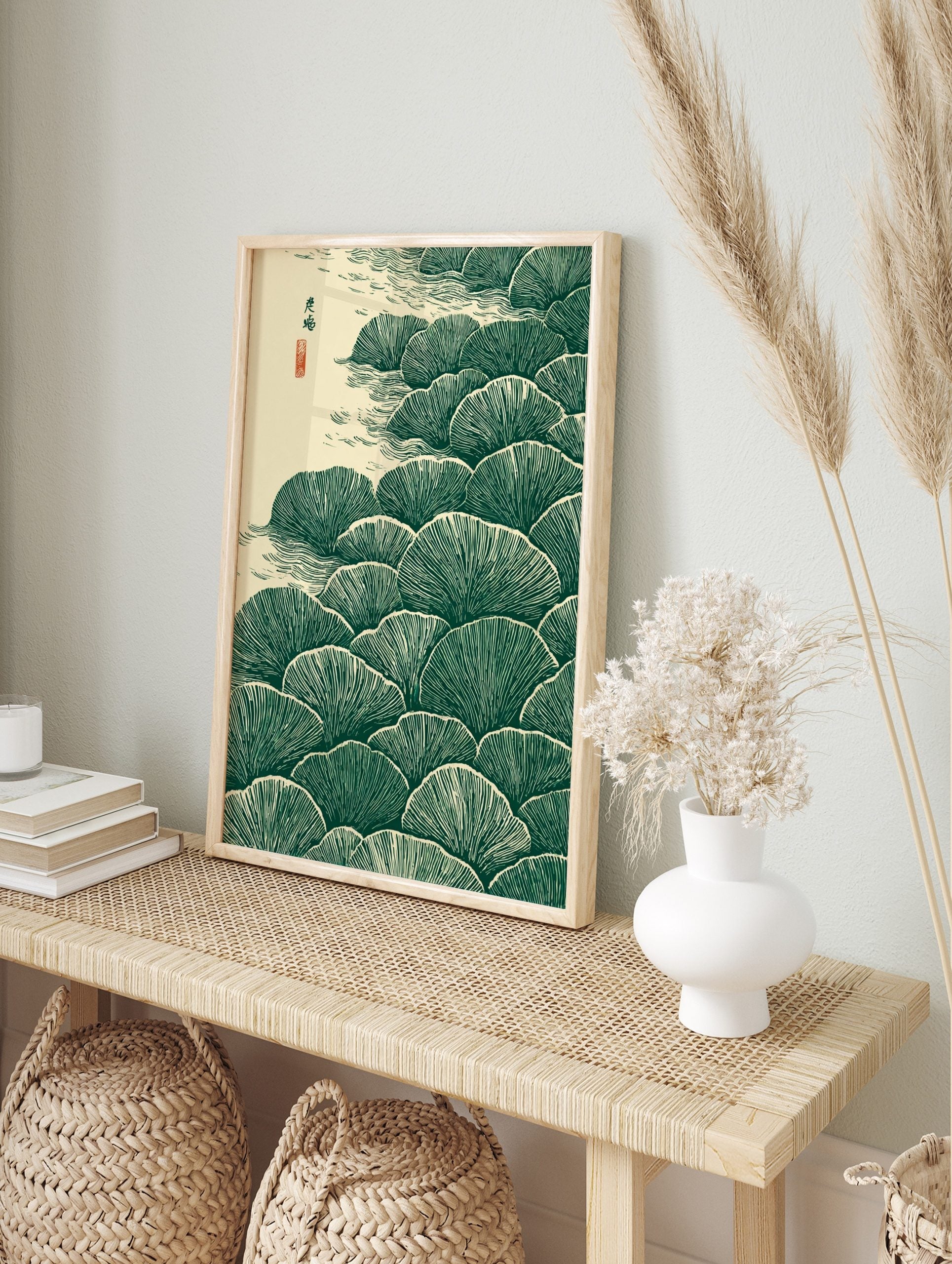 Stylised dark green ginkgo leaves in layers with beige water ripples and Japanese calligraphy, in an alternate framed mockup