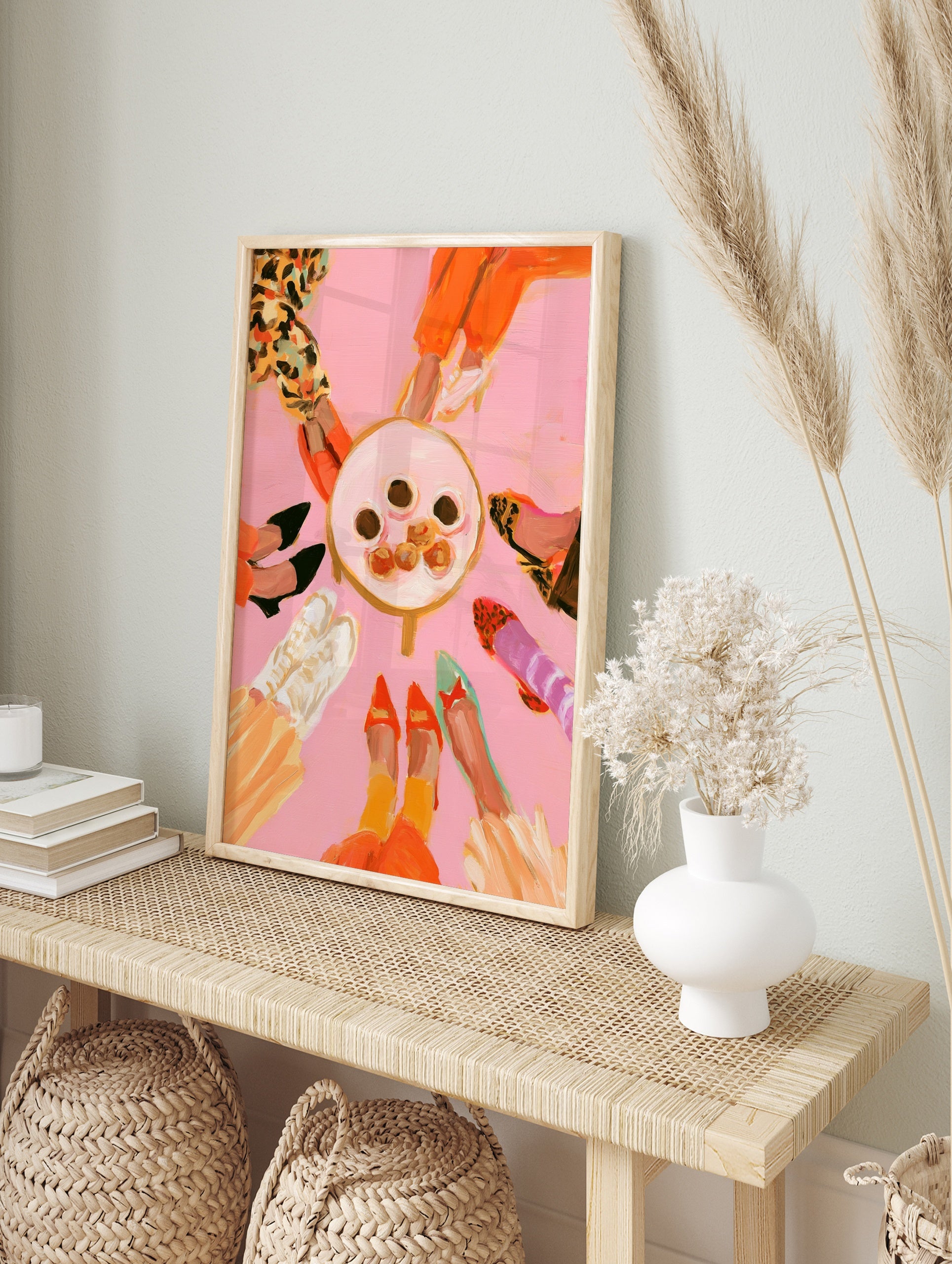 Fashion illustration of various colourful shoes in a circle around a table of treats on a, in an alternate framed mockup