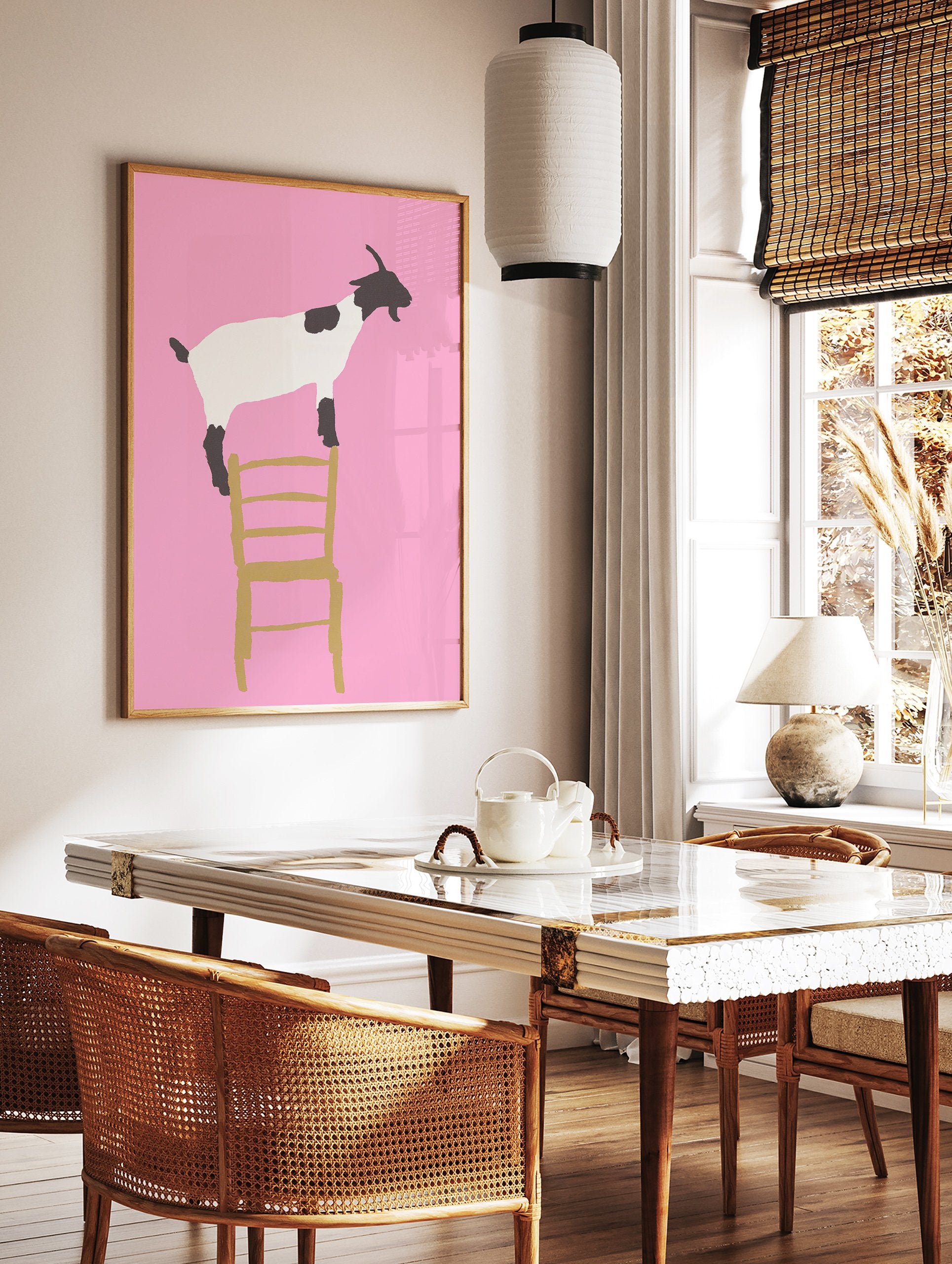 Minimalist illustration of a black and white goat standing on a gold chair against a vibrant pink background. Goat wall art. - Image 2