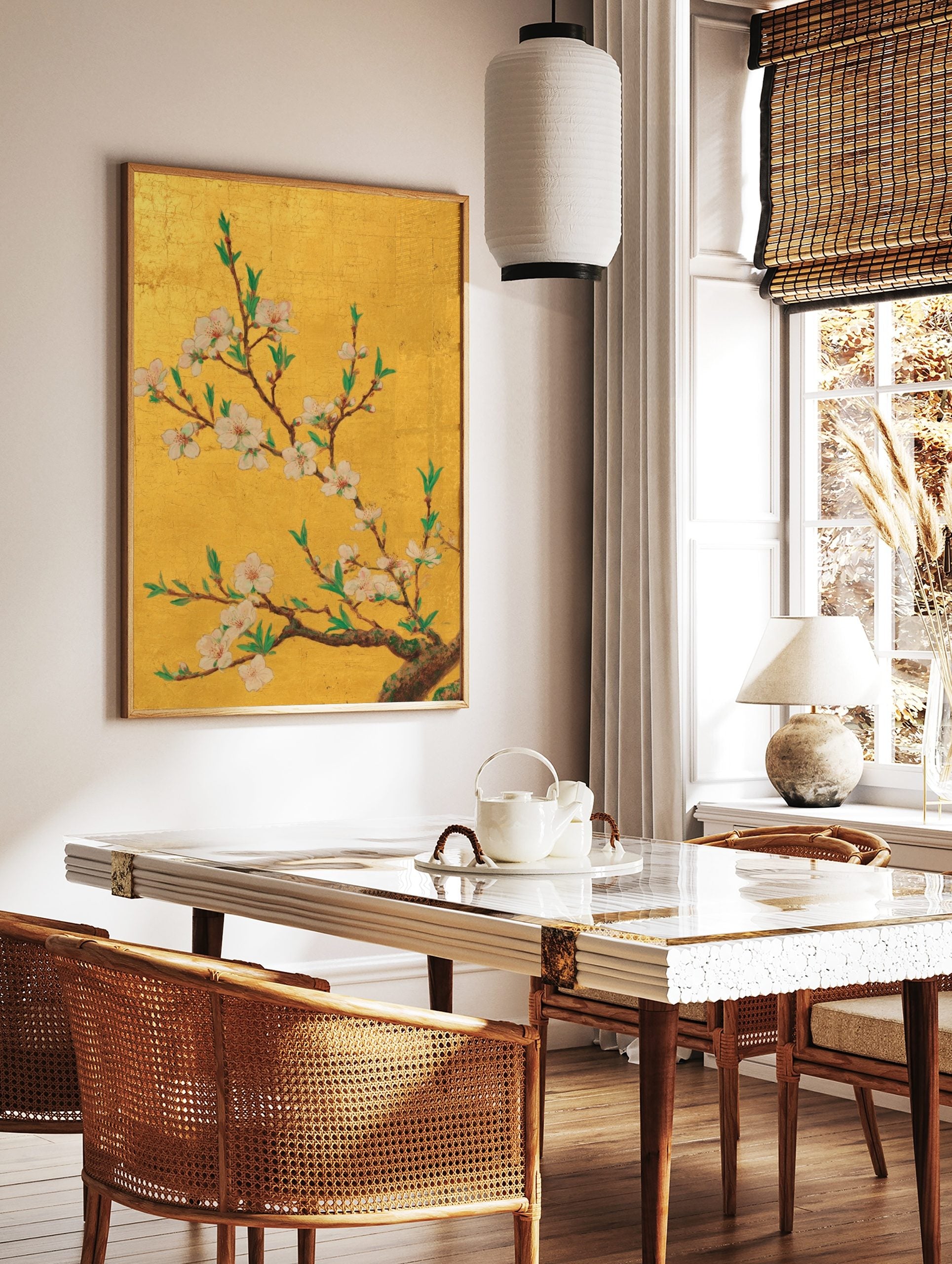 Gold cherry blossom wall art with white and pink flowers, green leaves, and brown branches on a, in a styled room mockup