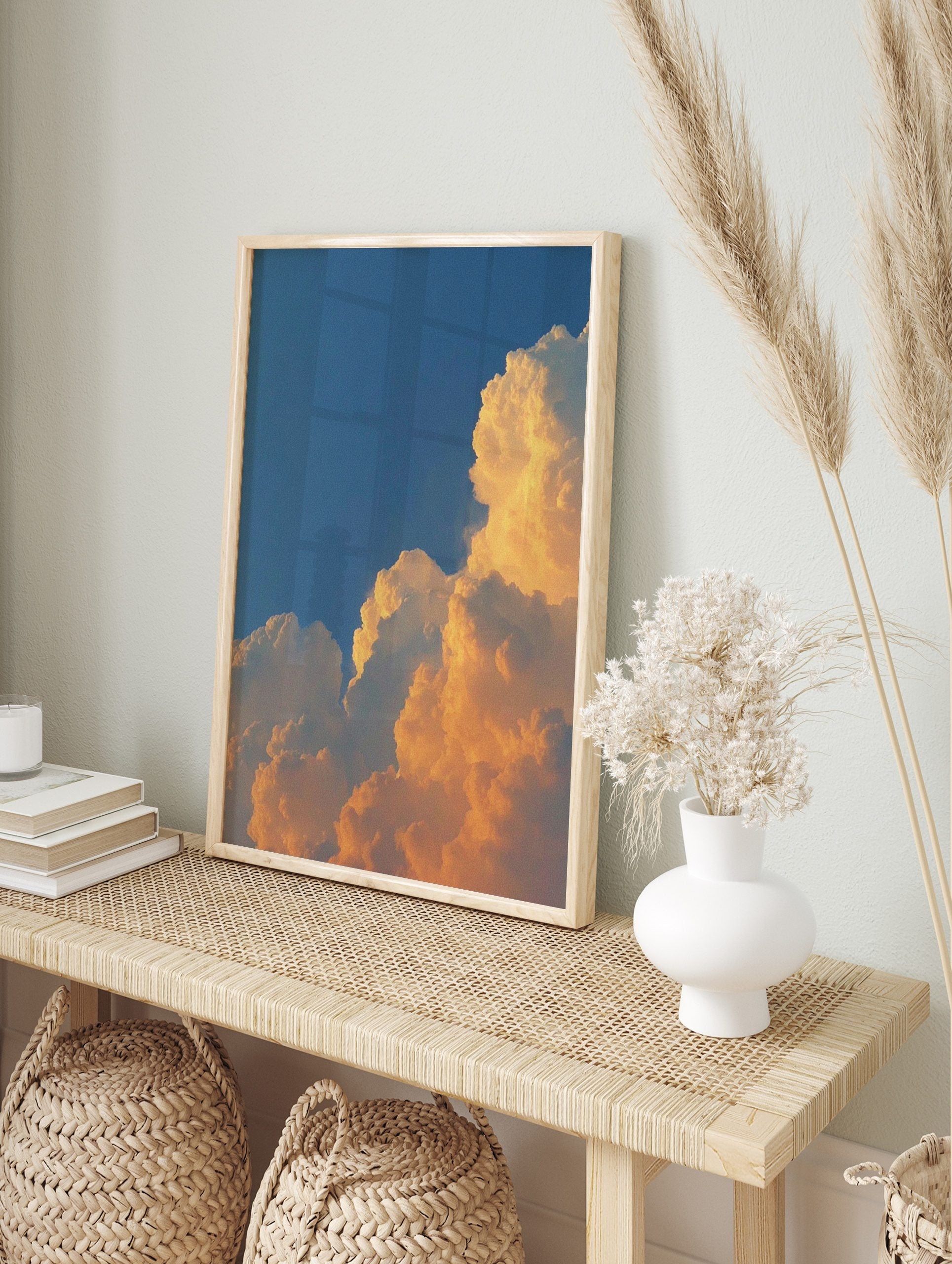 Dramatic golden cumulus clouds against a deep blue sky, capturing a vibrant sunset or sunrise, in an alternate framed mockup