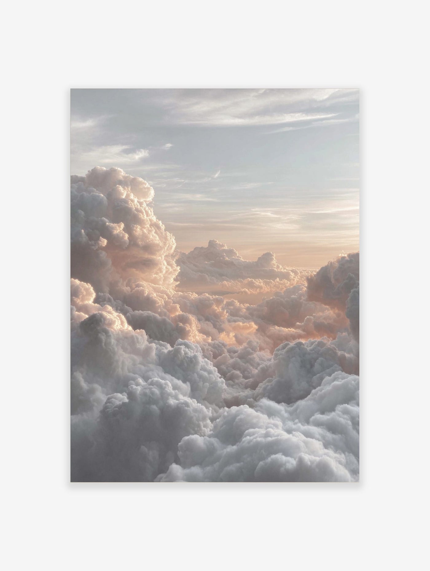 Photographic print of voluminous clouds bathed in warm golden and peach light at sunrise or sunset