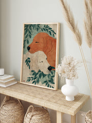 Illustrative Golden Retriever art print showing two sleeping dogs, one reddish-brown and one cream, surrounded by green leaves. - Image 3