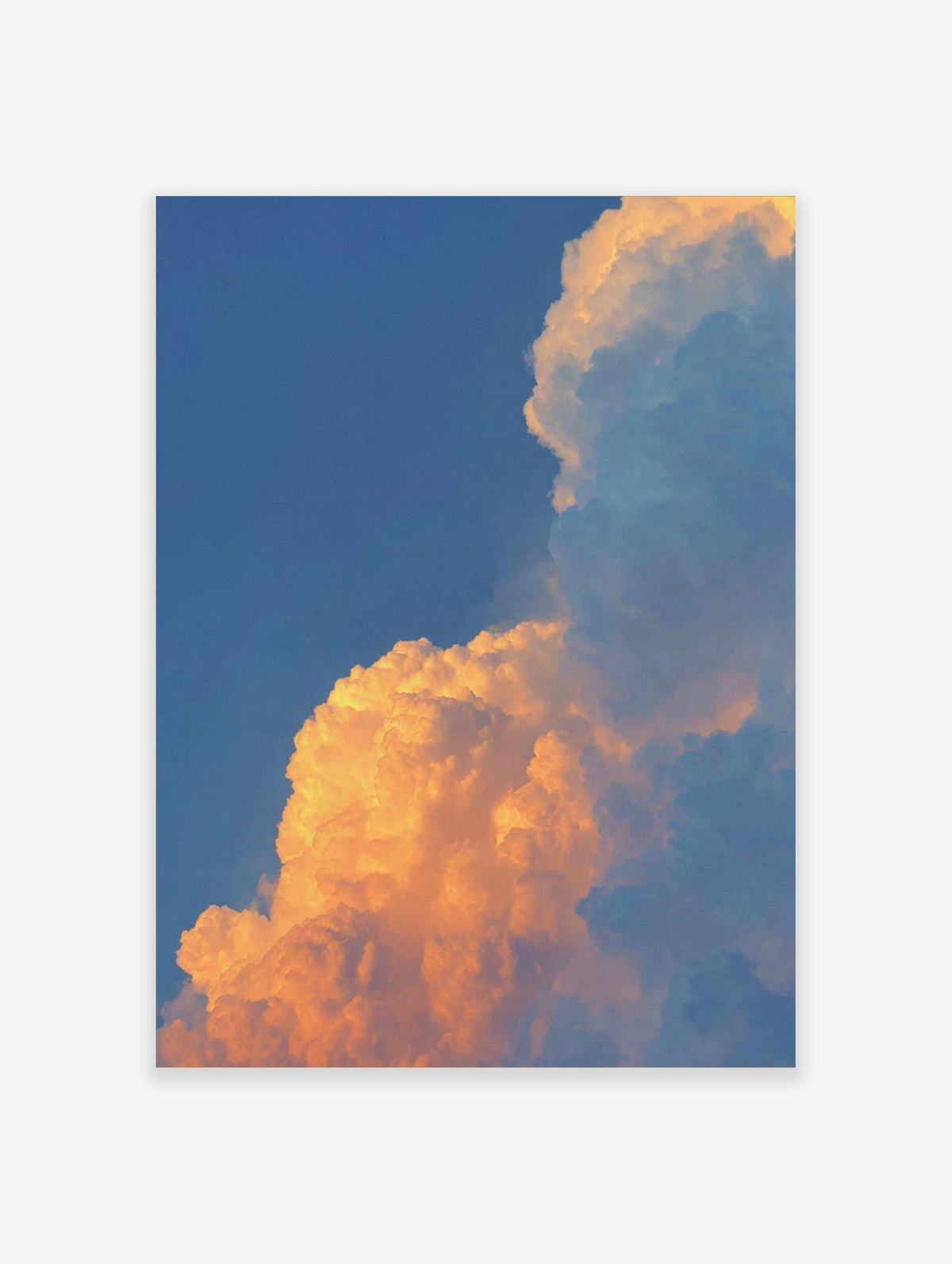 Dramatic golden orange sunset clouds against a clear blue sky, filling the frame with natural light
