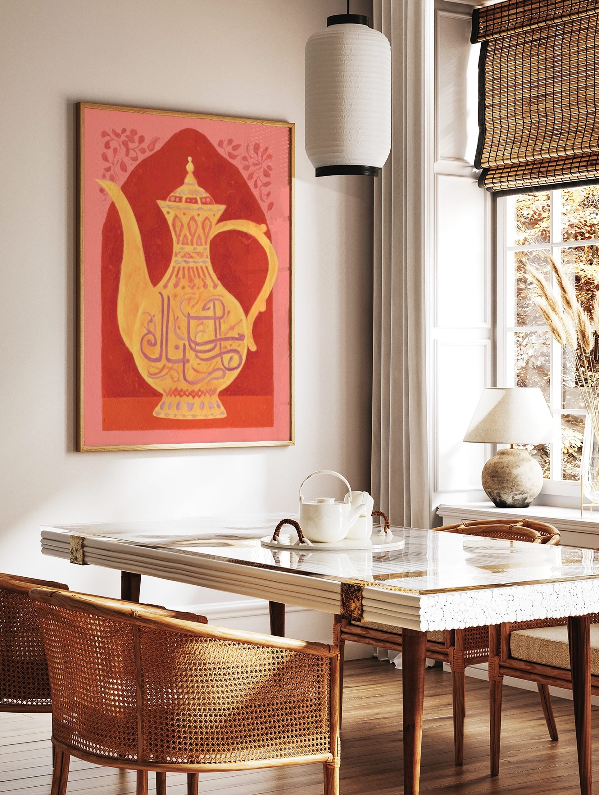 Ornate golden teapot with Arabic calligraphy and patterns against a red arched background, in a styled room mockup