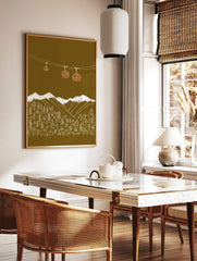 Illustrative gondola cabins above snow-capped mountains and forest on an olive green background, in a styled room mockup