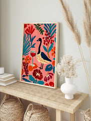 Colourful illustrative wall art of a goose, red wine glass, and abstract botanical elements, in an alternate framed mockup