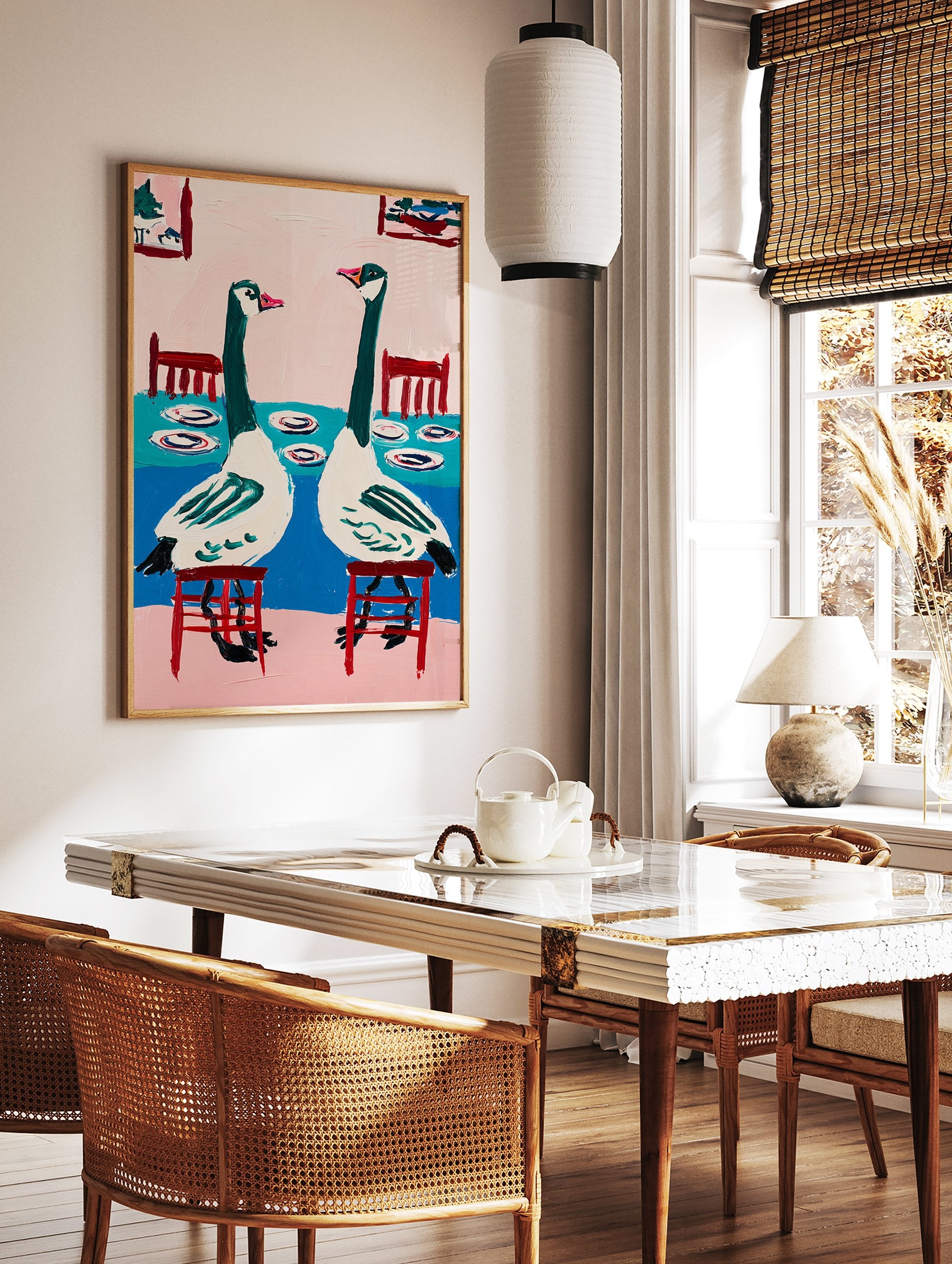 Modern goose wall art painting showing two green and white geese sitting at a blue table with pink background - Image 2