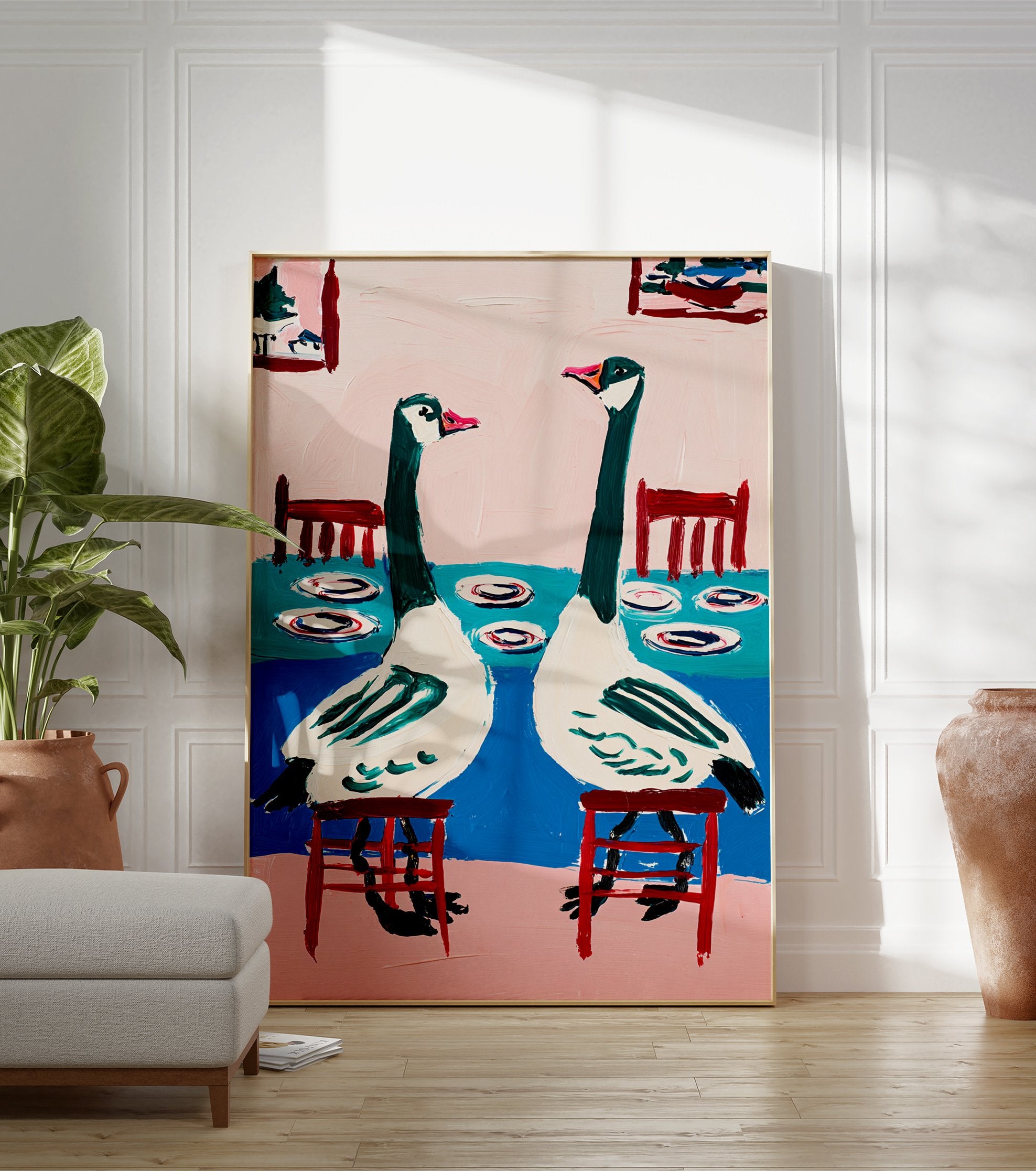 Modern goose wall art painting showing two green and white geese sitting at a blue table with pink background - Image 3