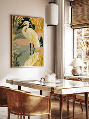 Illustrative print of a white great egret in water with green and yellow stylised foliage, peach sky, in a styled room mockup