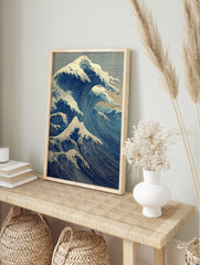 Japanese Great Wave wall art print with powerful blue ocean waves, white foam, and a small, in an alternate framed mockup