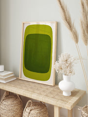 Green abstract wall art print with dark green inner rectangle and lime green outer border on, in an alternate framed mockup