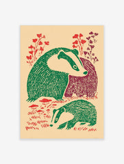 Illustrative print of two badgers with green and maroon bodies, red foliage, on a beige background