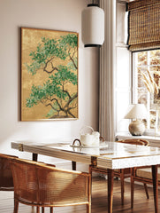 Green botanical tree branches with leaves against a textured gold background in an illustrative art, in a styled room mockup