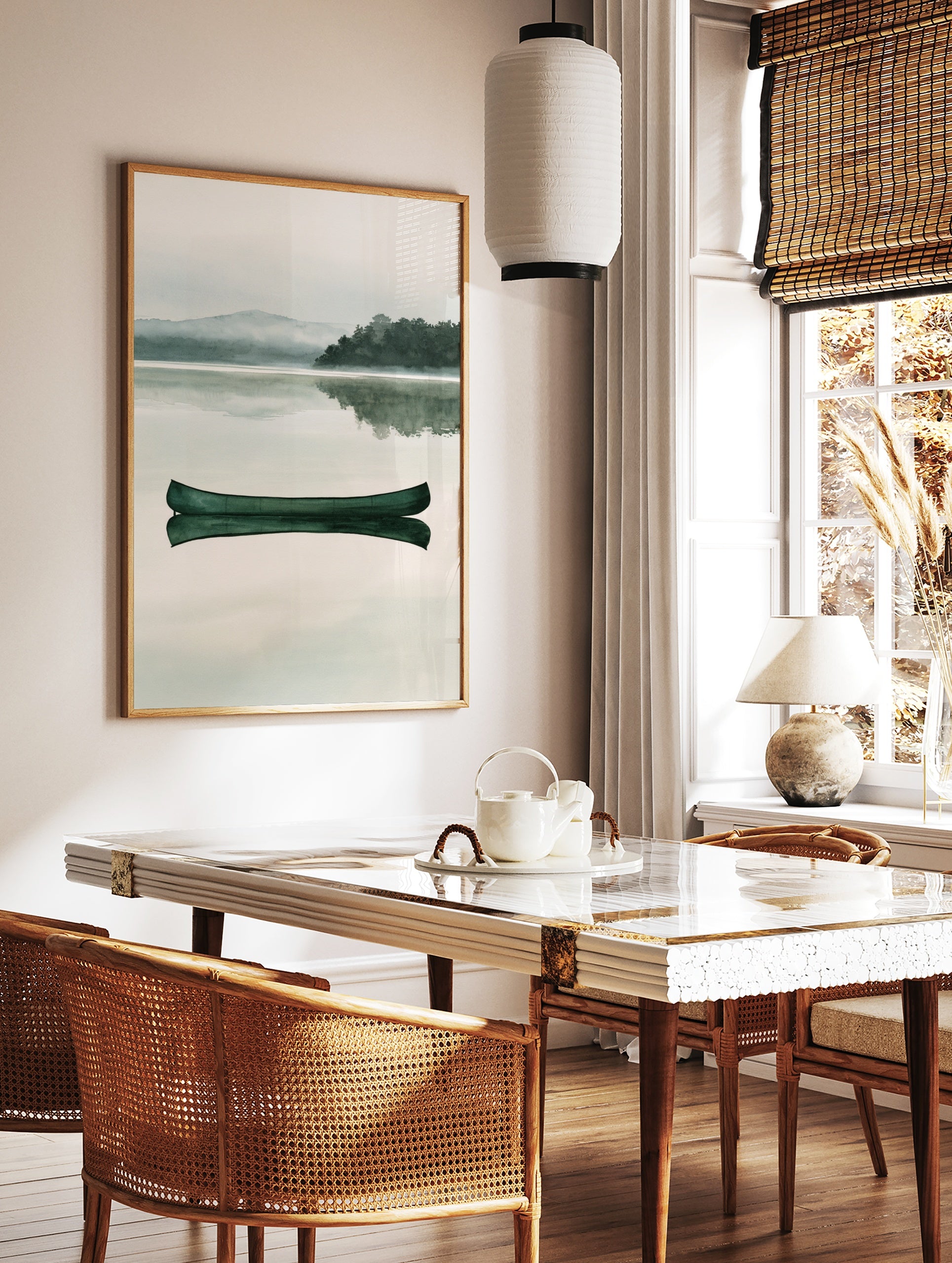Green canoe floating on a calm, misty lake with a mountain and forest background in a watercolour, in a styled room mockup