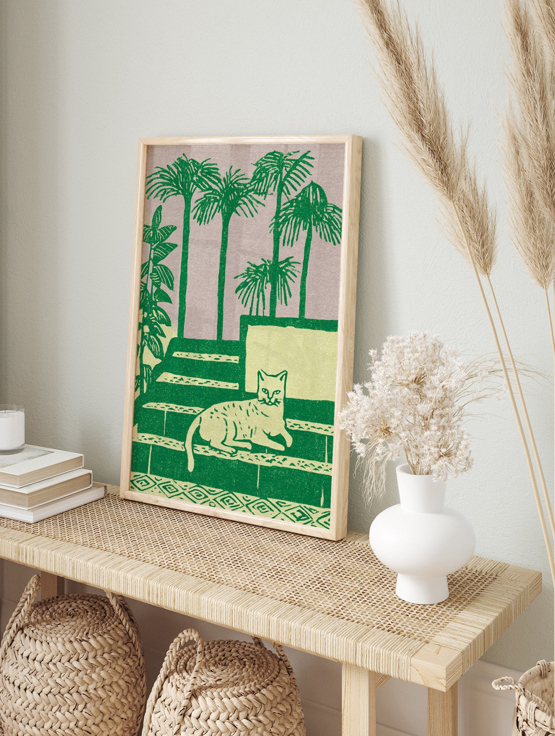 Green cat wall art illustration with a cat lying on steps, surrounded by palm trees and plants on a light purple background. - Image 3