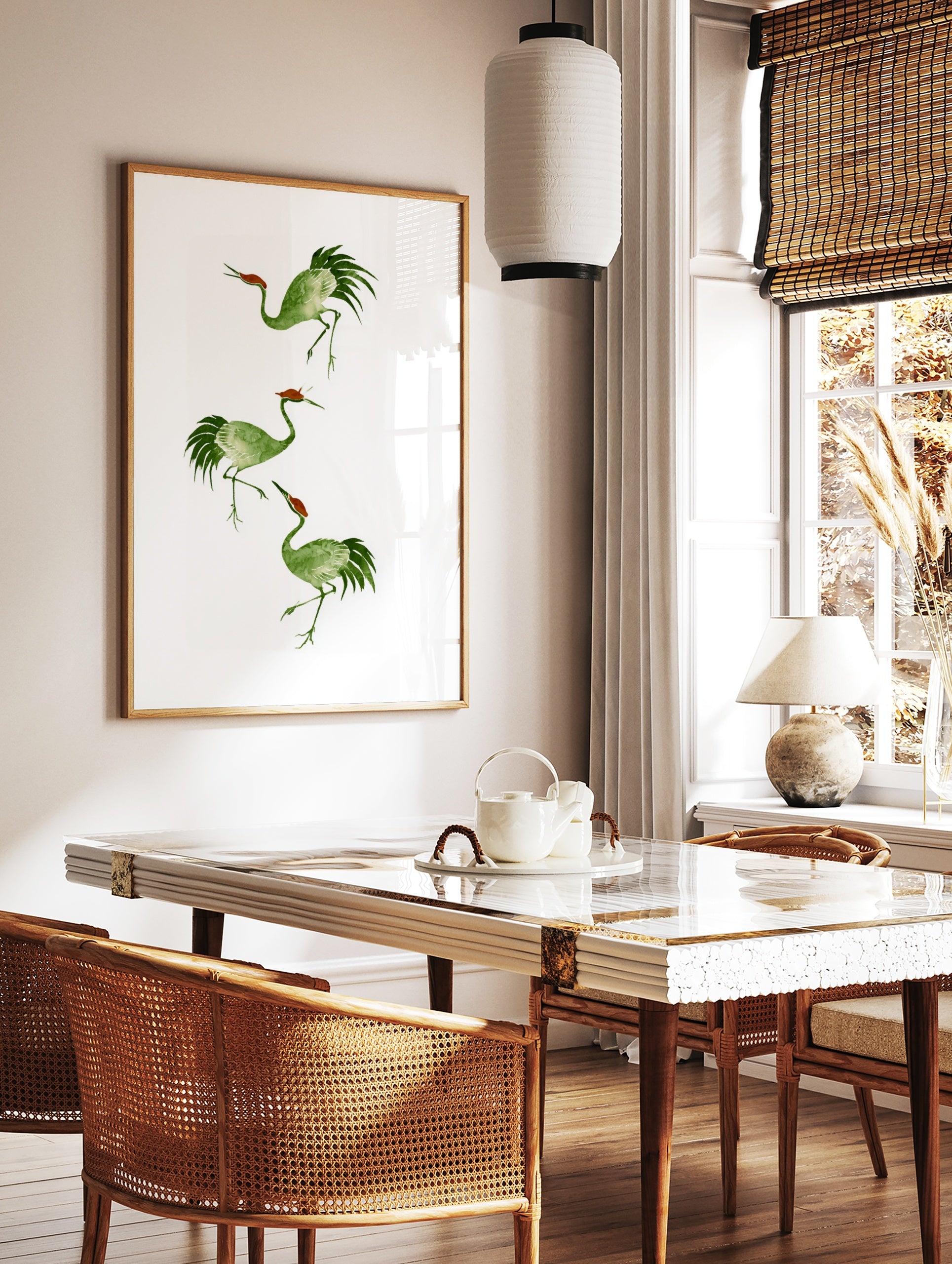 Three watercolour style green cranes with reddish crowns in a vertical arrangement on a white, in a styled room mockup