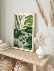 Green ducks swimming in a river with birch trees and foliage in an illustrative print style, in an alternate framed mockup