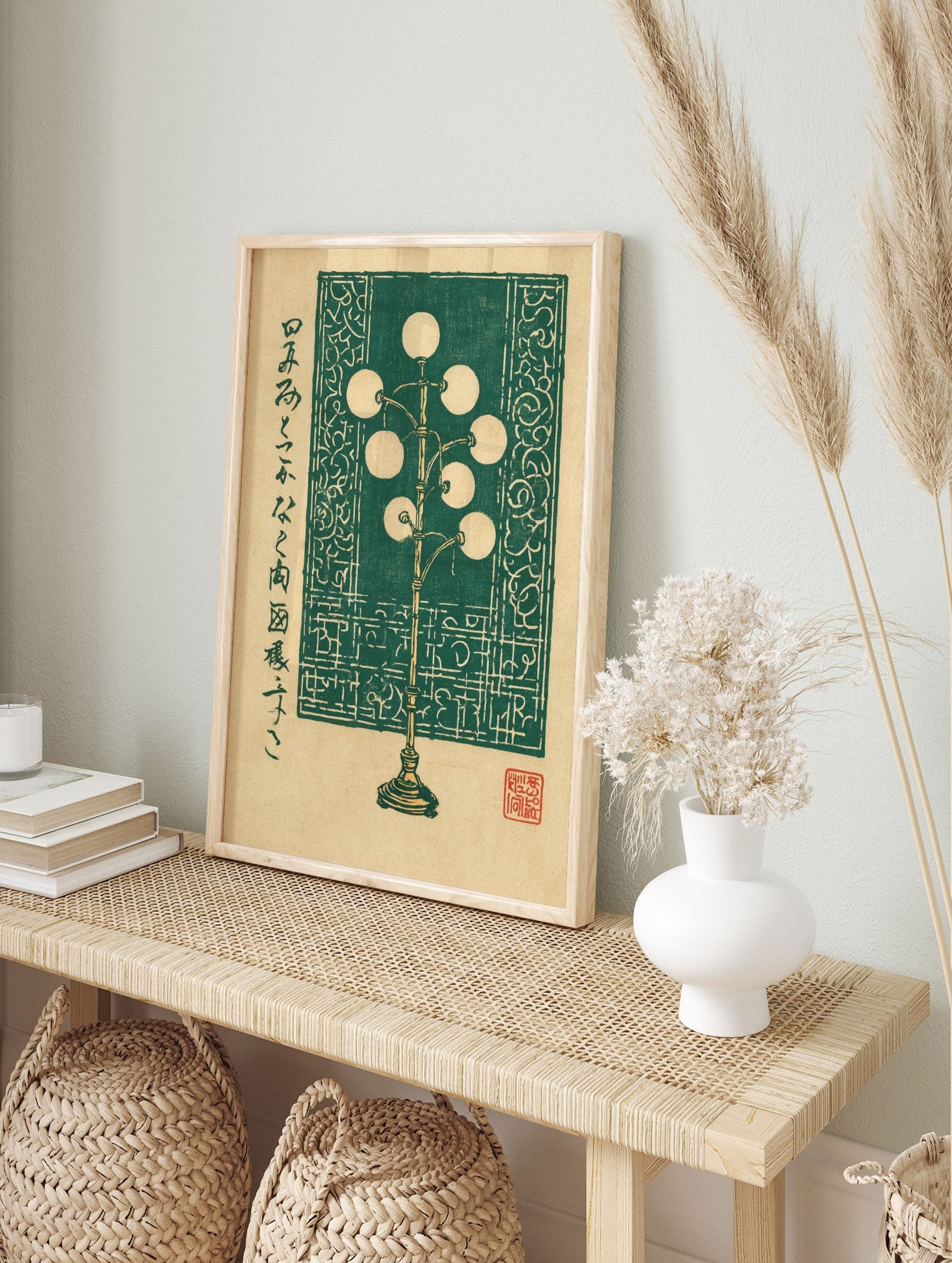 Green floor lamp illustration in woodblock style with spherical lights and Japanese text on a, in an alternate framed mockup