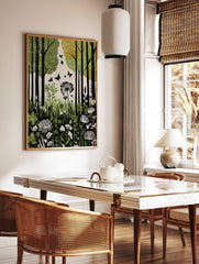 Green forest botanical print with black tree trunks, flying butterflies, and white wildflowers in, in a styled room mockup