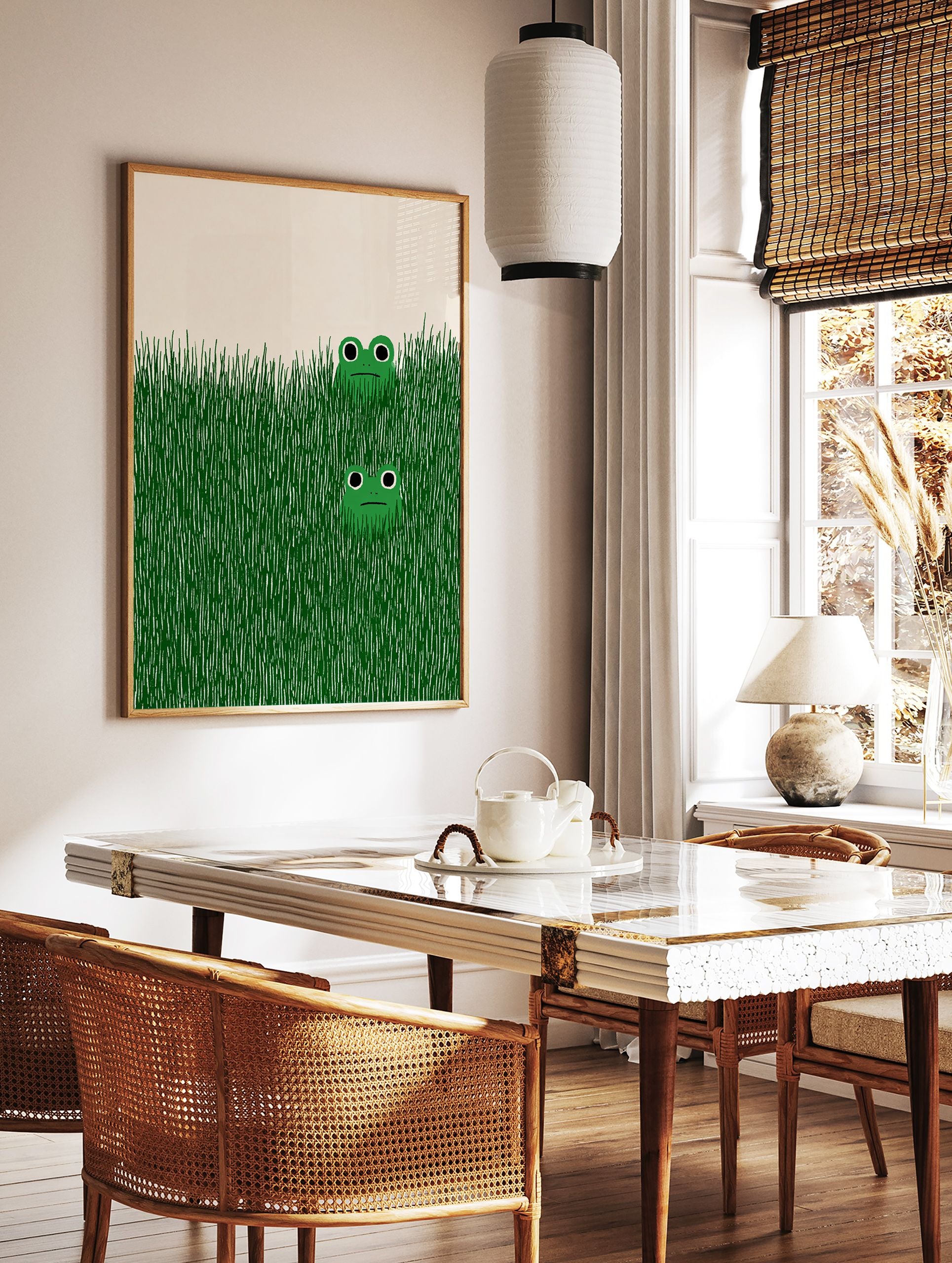 Illustrative green frog wall art print showing two cartoon frogs peeking from tall green grass on a light background. - Image 2