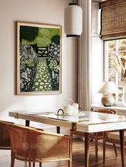 Linocut print of a garden path with white stepping stones leading to a dark wooden gate and, in a styled room mockup