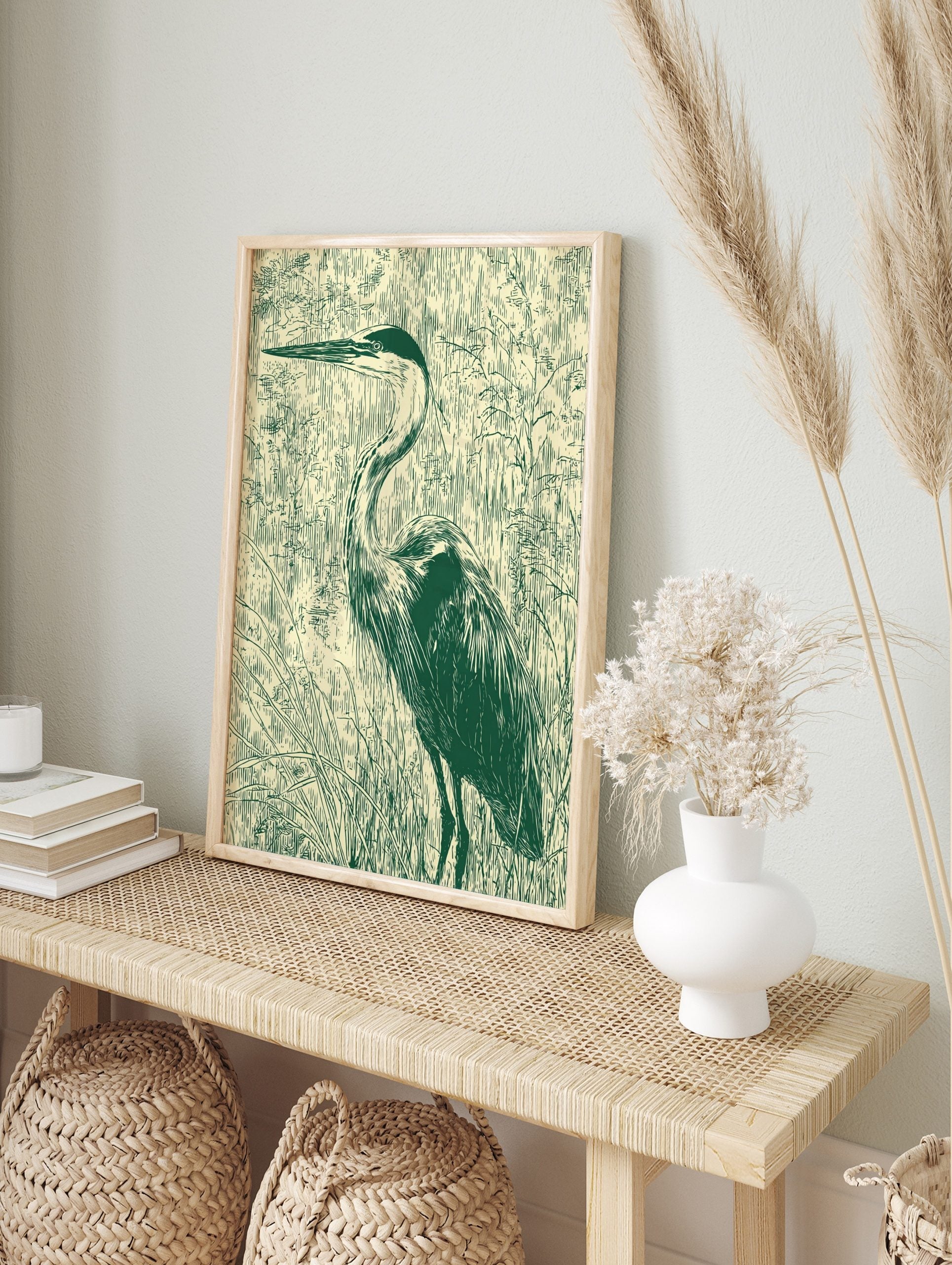 Illustrative green heron bird print standing in marsh grasses on a light beige background in, in an alternate framed mockup
