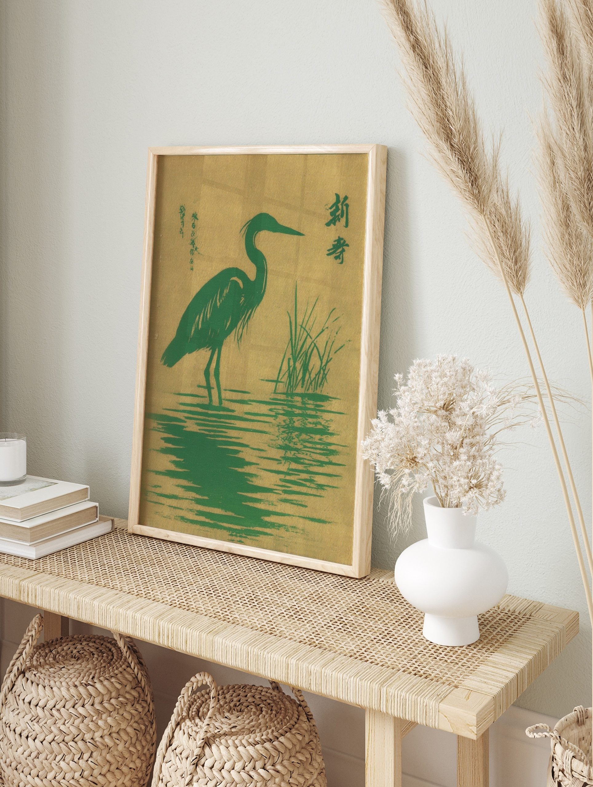Green heron bird standing in water with reeds, Japanese characters, green and golden-tan, in an alternate framed mockup