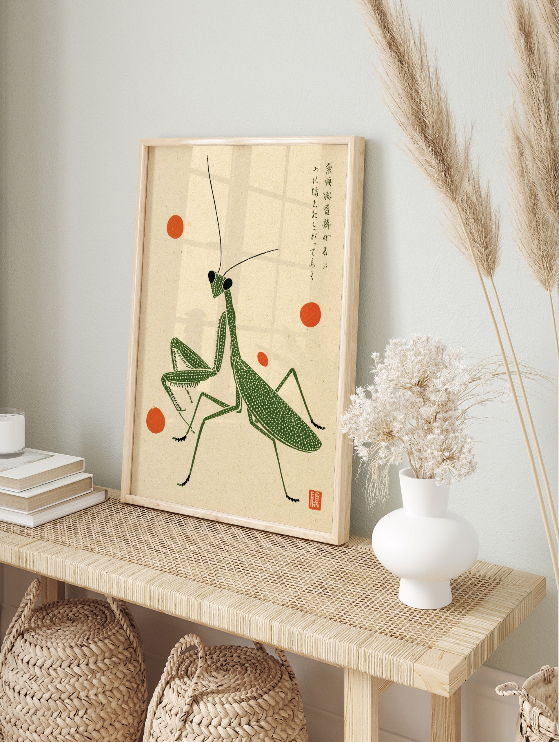 Green praying mantis illustration with stippled texture, orange accents, and Japanese kanji, in an alternate framed mockup