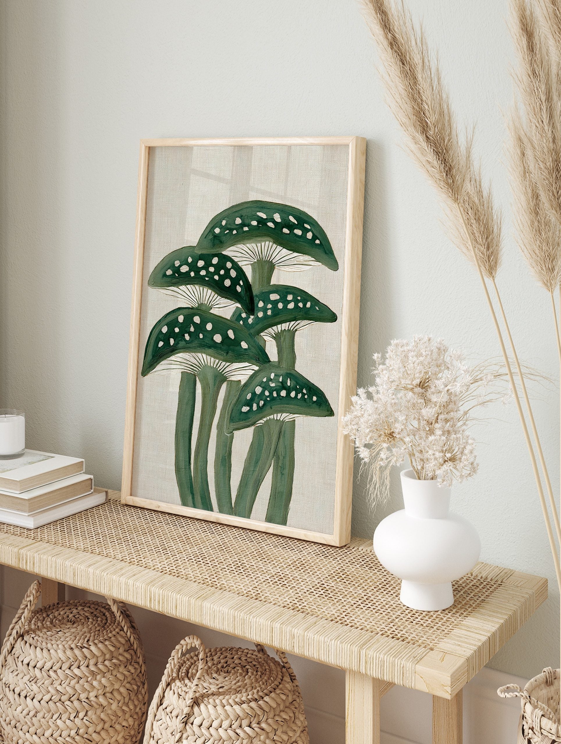 Illustrative green mushrooms with white spots and gills on a textured beige background, in an alternate framed mockup