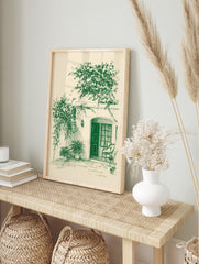 Green sketch art print of a tranquil patio with an arched doorway, climbing vines, potted, in an alternate framed mockup