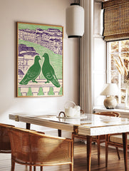 Green pigeon wall art featuring two pigeons on a balcony overlooking a city with purple-roofed buildings - Image 2