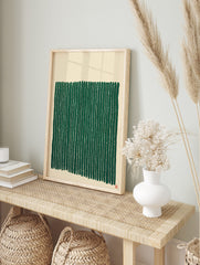 Abstract green vertical stripes wall art on a beige background with a small red seal, in an alternate framed mockup