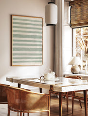 Green and white horizontal striped abstract wall art with hand-drawn texture on satin paper, in a styled room mockup