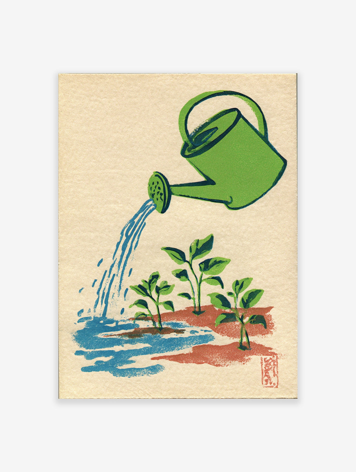 Green watering can pouring blue water over three seedlings in red soil on a beige background