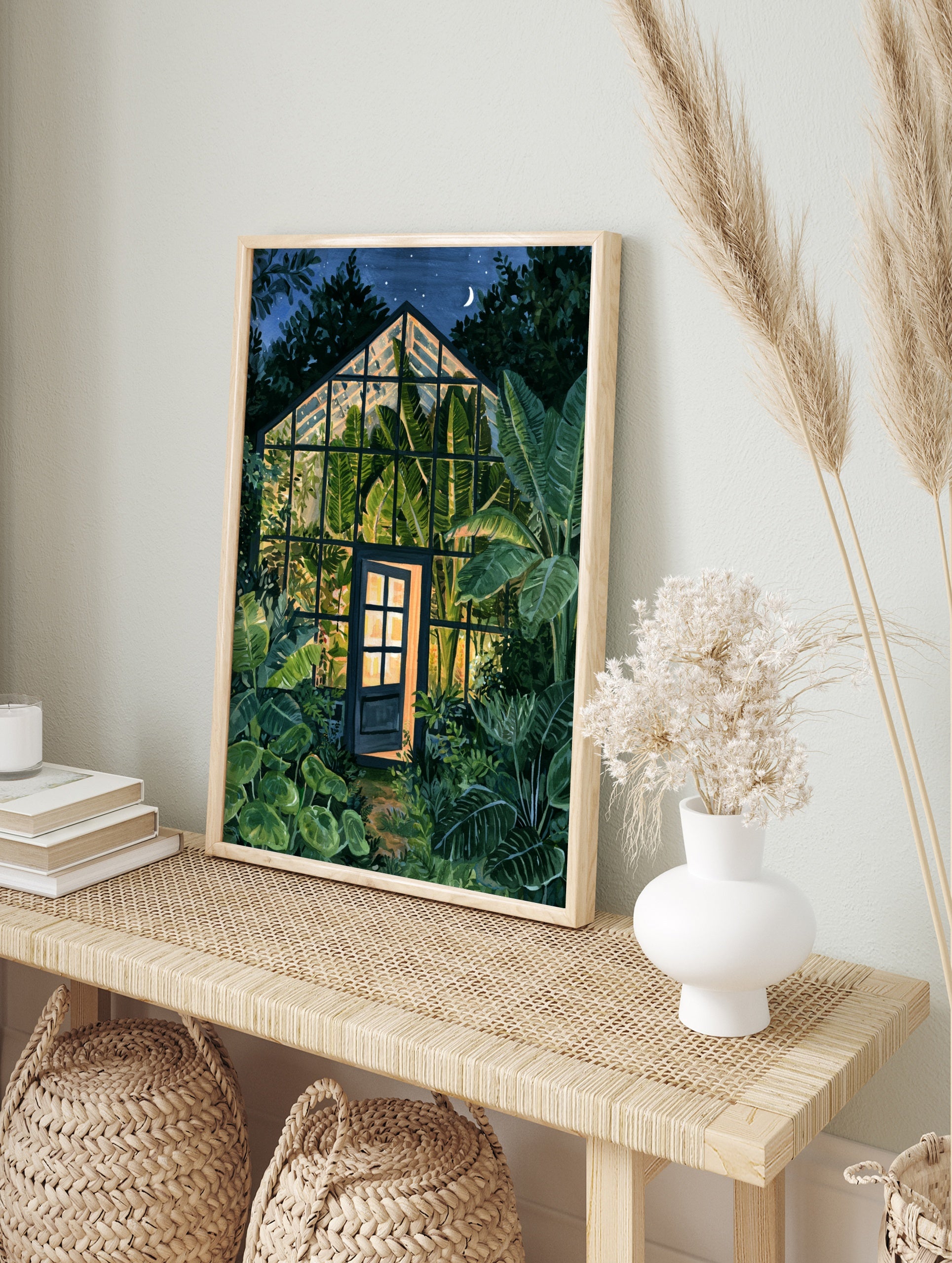 Illustration of a glowing greenhouse at night surrounded by lush tropical banana leaves under, in an alternate framed mockup