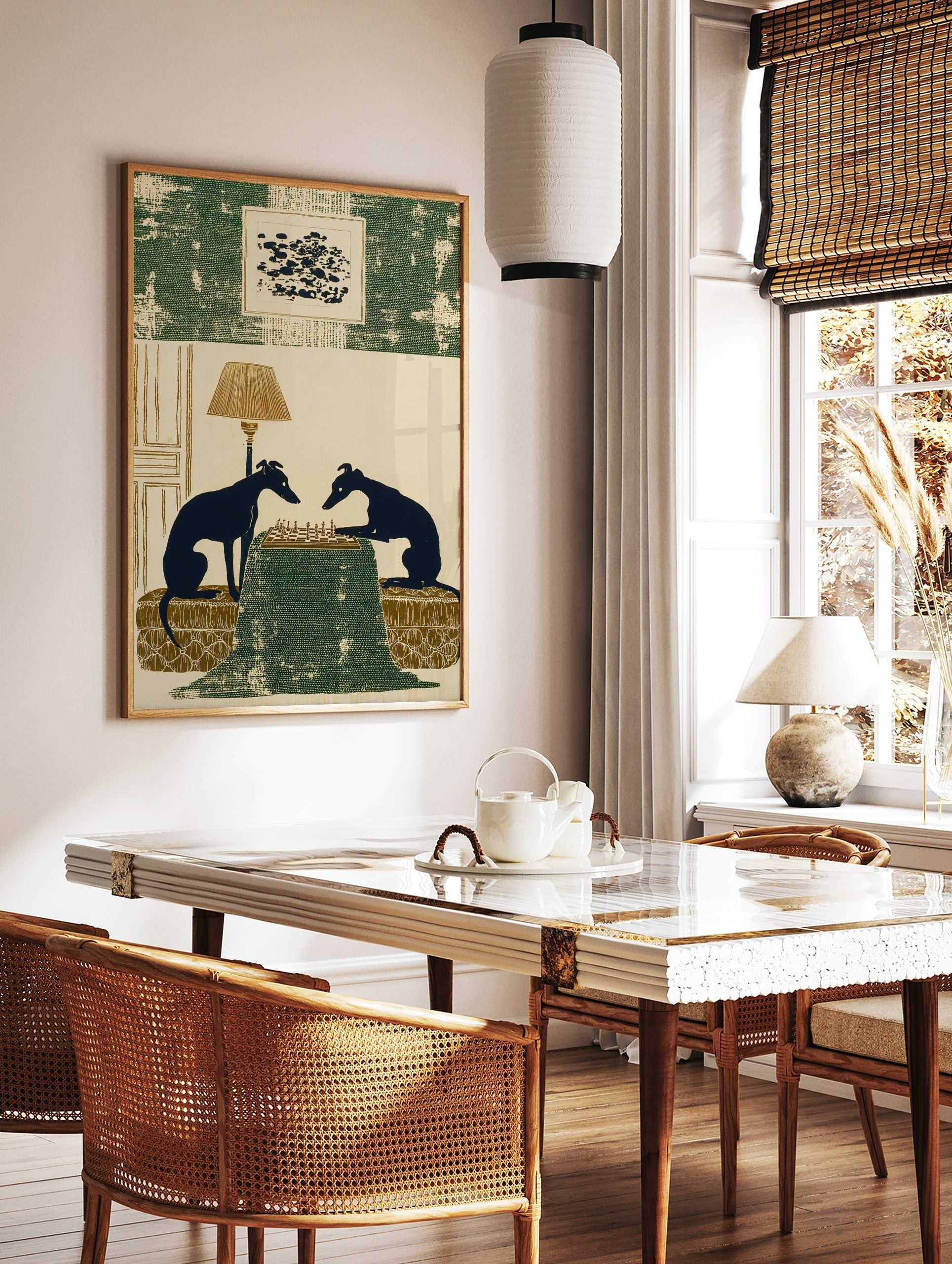 Illustrative print of two dark blue greyhound silhouettes playing chess on a green table with a lamp, in a styled room mockup