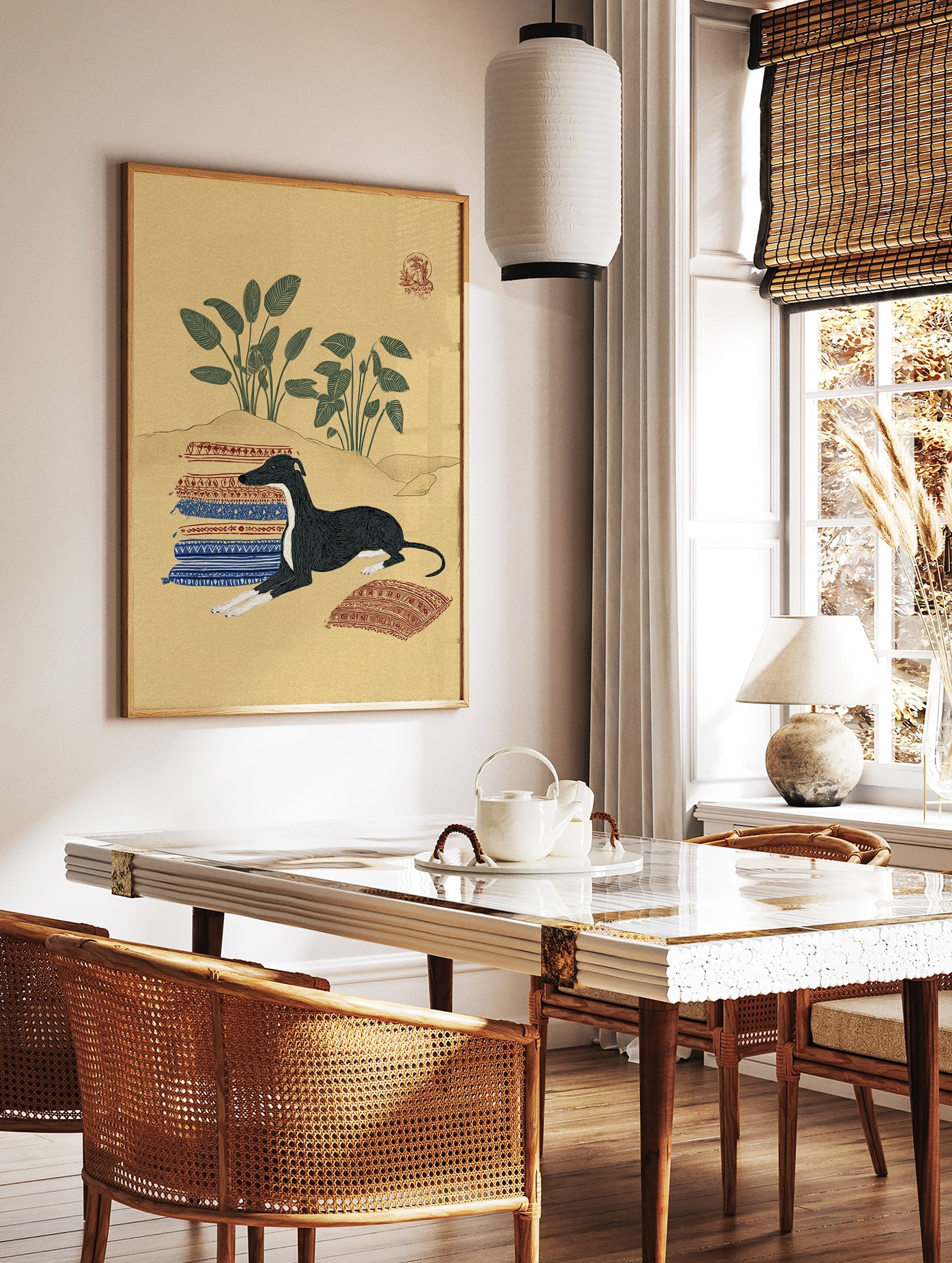Illustrative art print featuring a black and white Greyhound dog lying on patterned rugs in a desert landscape with green plants. - Image 2