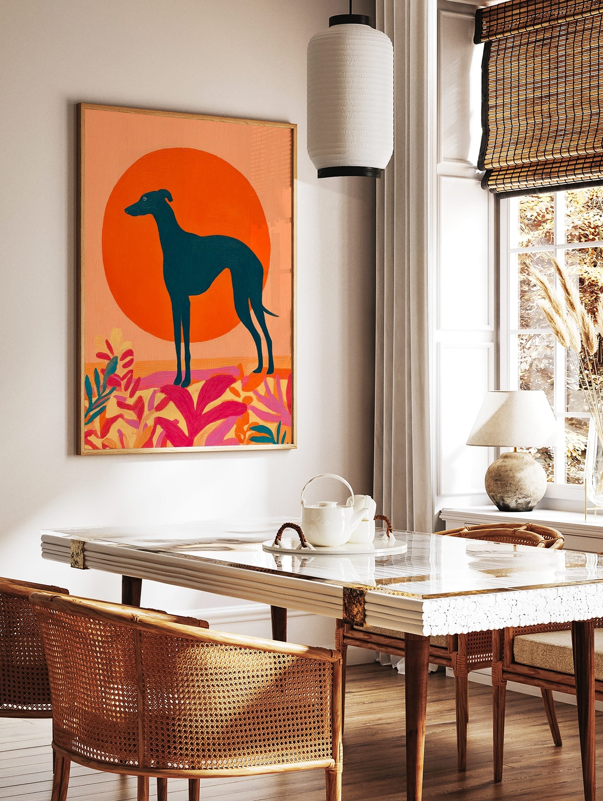 Teal greyhound dog silhouette against a large orange sun with vibrant pink and yellow abstract, in a styled room mockup