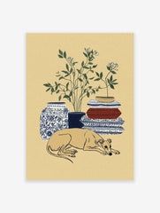 Greyhound wall art print of a sleeping dog with botanical plant, blue vase, and patterned blankets.