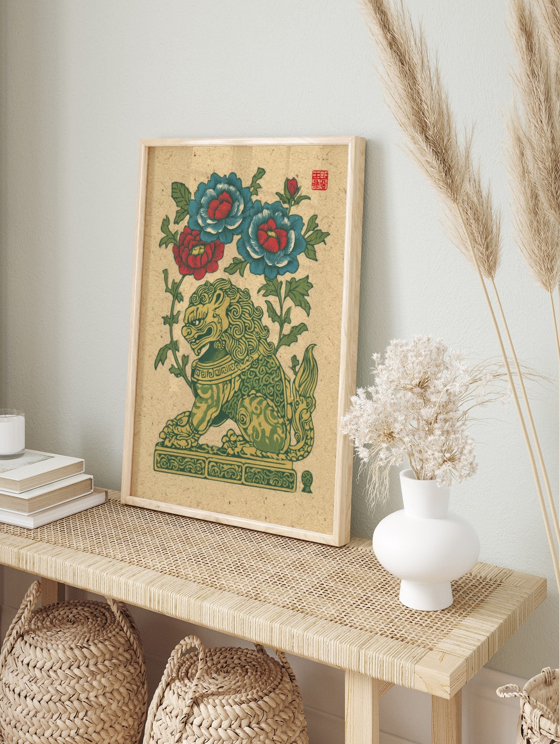 Green and gold guardian lion with red and blue peony flowers, illustrative folk art print on, in an alternate framed mockup