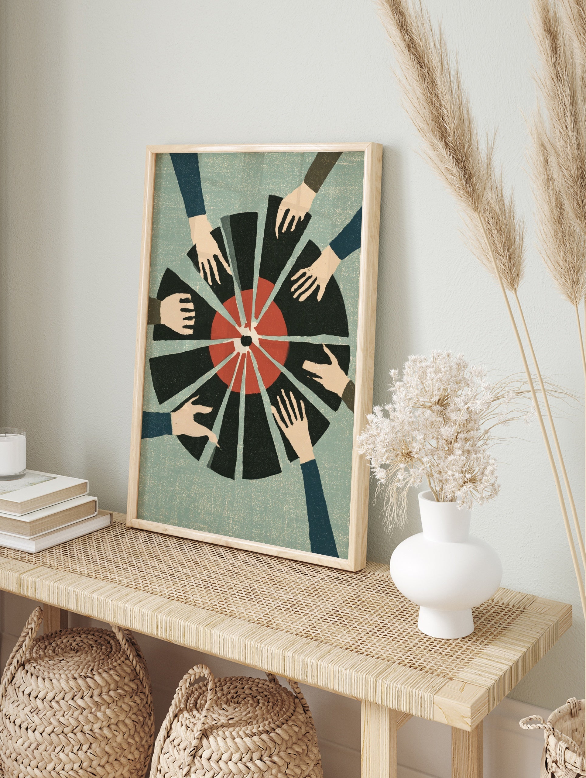 Graphic illustration of multiple hands reaching towards a red and black segmented circular, in an alternate framed mockup