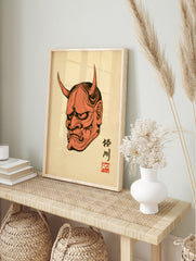 Hannya mask Japanese demon illustration with kanji and red seal on cream paper background, in an alternate framed mockup