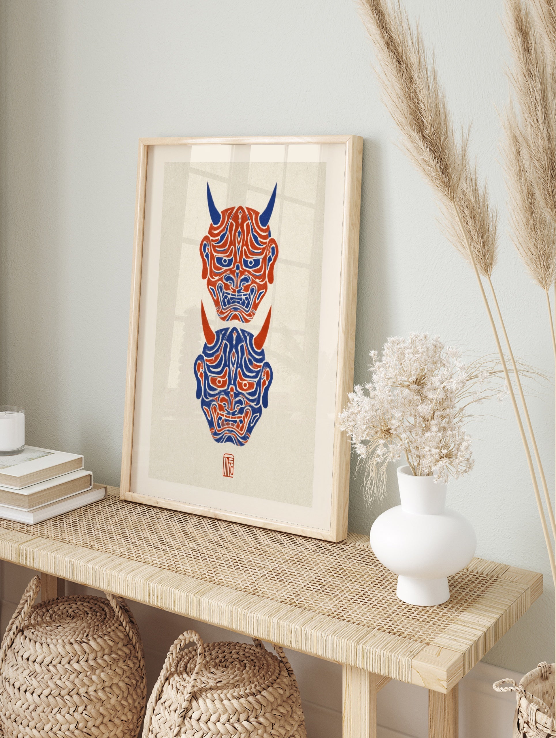 Vertical Hannya mask wall art featuring two Japanese demon masks in red and blue on a, in an alternate framed mockup