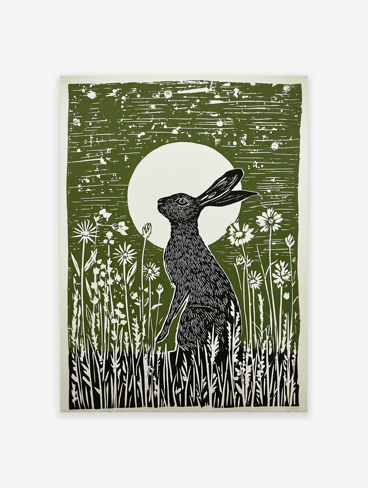 Green linocut print of a black hare sitting in wildflowers under a full moon, capturing a serene nocturnal scene.