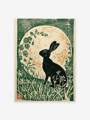 Black hare silhouette against a gold speckled moon, surrounded by green foliage in a linocut style print